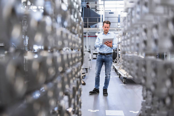 Engineer using a tablet in a manufacturing environment